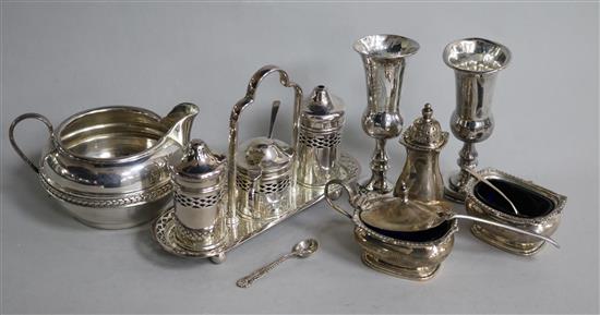 A silver jug, two condiment sets and two silver Kiddush cups.